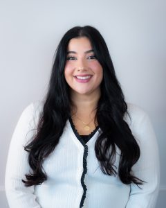 A woman smiling.